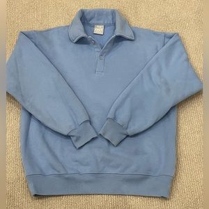 Aritzia TNA blue crew neck sweatshirt with a collar.